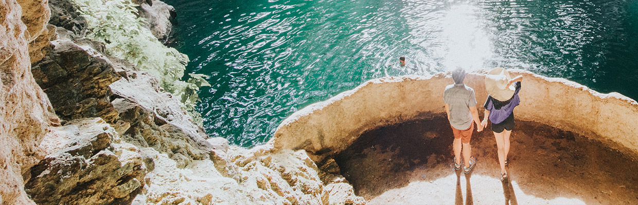 Couple exploring cave